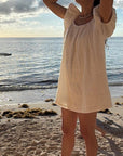 Woman in a white linen dress - beach cover up - summer cocktail dress