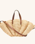 Handwoven raffia beach tote in scallop shell shape with crossbody strap