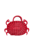 Red rattan crossbody bag shown with leather strap — playful summer accessory