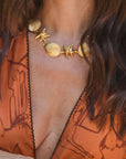 Shell and starfish detail on gold necklace