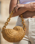 Chunky gold acrylic chain strap on nautilus shell bag