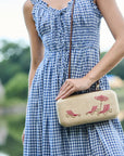 The Deck Chairs Clutch worn on the shoulder