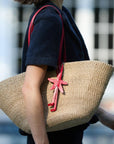 The East West Charm Tote carried on the shoulder