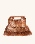Tinsel fringe detail with raffia-wrapped handle