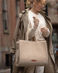 The Teddy Tote sherpa tote bag worn on the arm