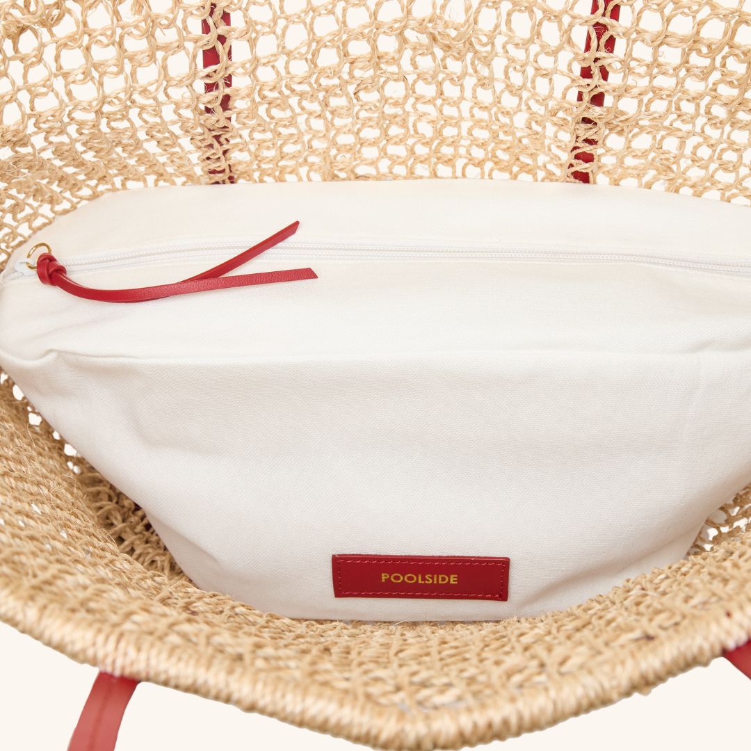 Interior detail of large open weave beach tote bag with double shoulder straps