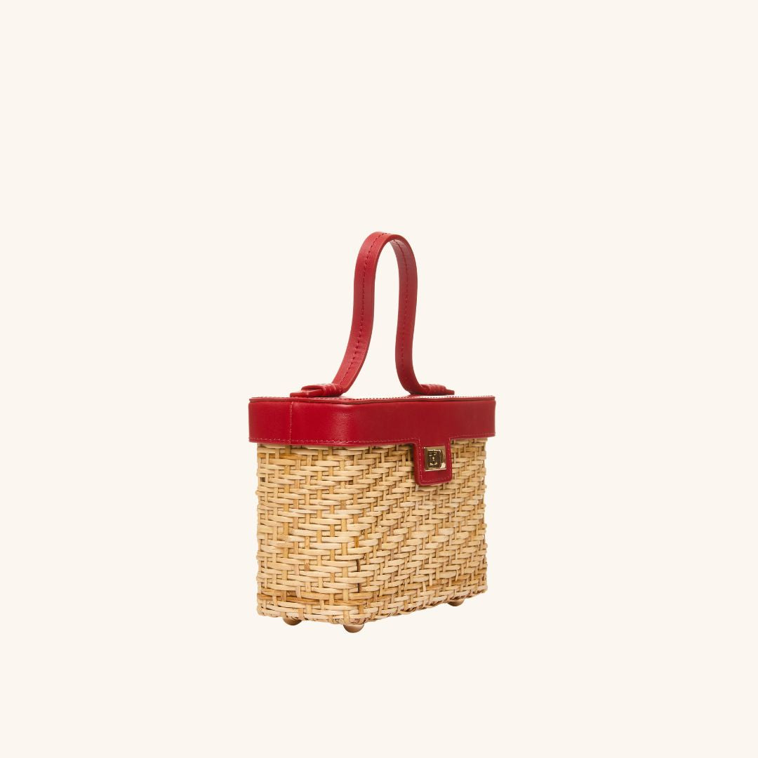 The quarter view of The Box Bag Vanity Case with red leather top