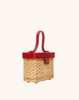 The quarter view of The Box Bag Vanity Case with red leather top