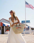 Large straw beach tote with short handles - customized straw beach tote bag - carried by Rocky Barnes in The Hamptons