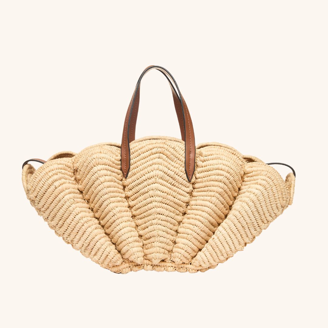 Raffia shell tote bag designed for beach vacations and summer travel