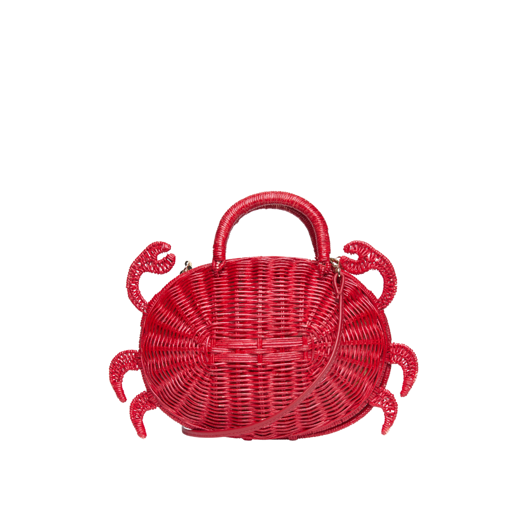 Red rattan crossbody bag shown with leather strap — playful summer accessory