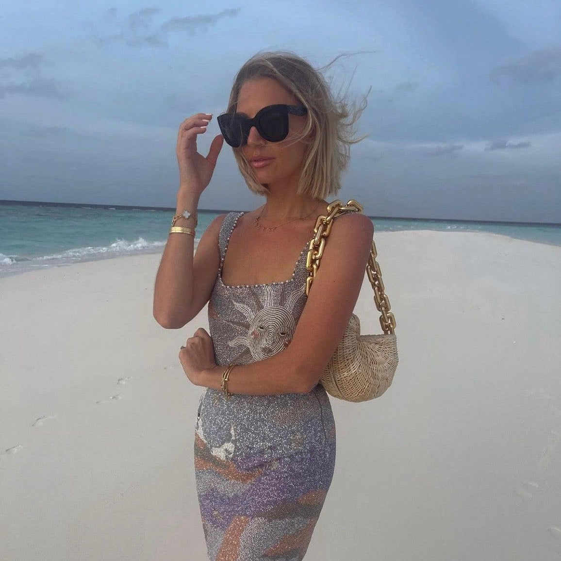 The Anna Conch worn as a statement summer bag