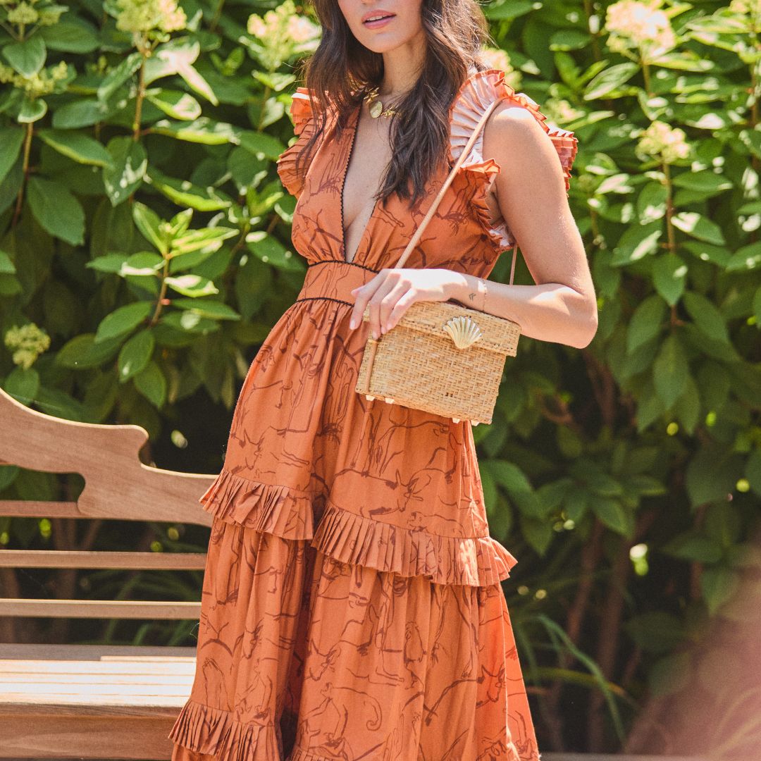 Vintage-inspired straw box bag with leather shoulder strap worn on the shoulder - The Box Bag