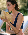 Rattan clutch with gold seashell clasp and chain strap – The Classica Clutch