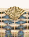 Clasp detail on rattan clutch with gold seashell clasp 