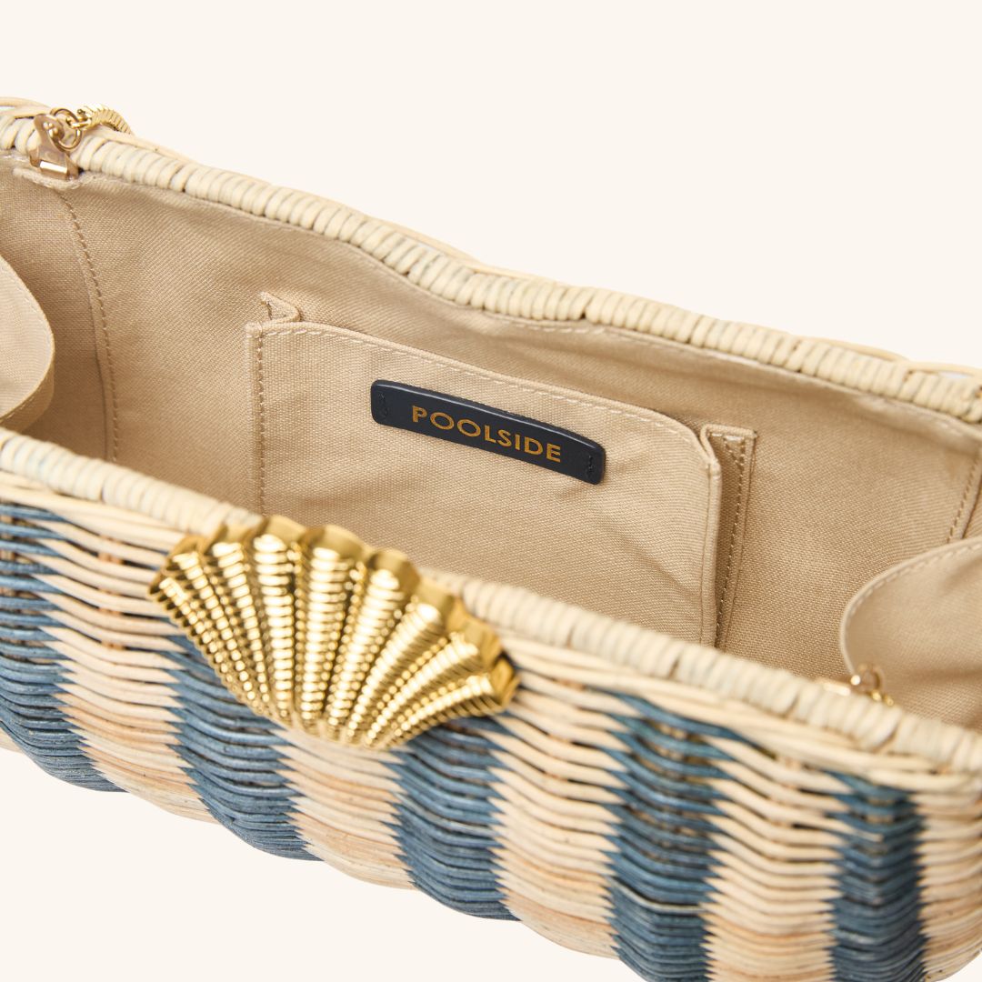 Interior detail of rattan clutch with gold seashell clasp