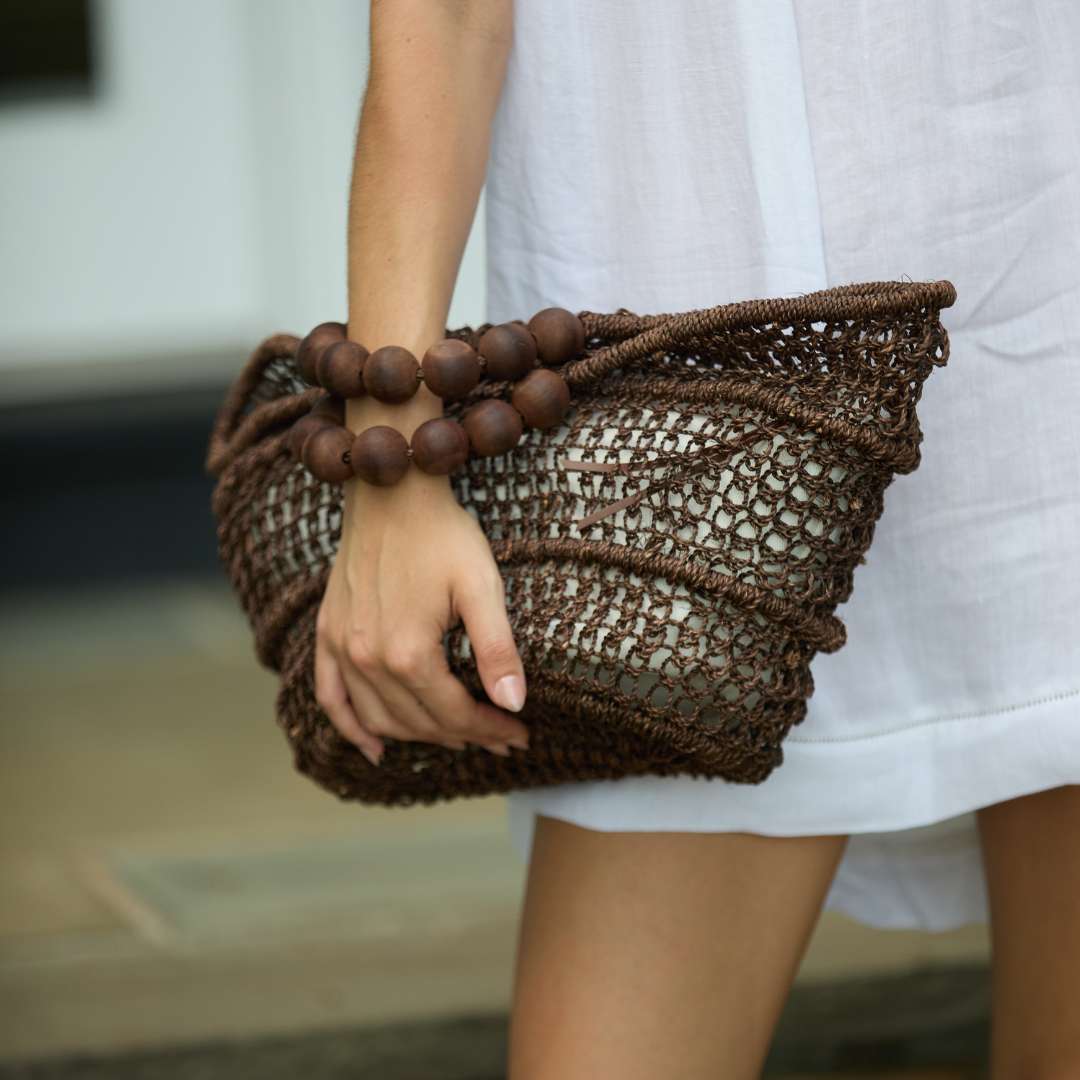 Close-up of ball bracelet handle on The Comporta Tote