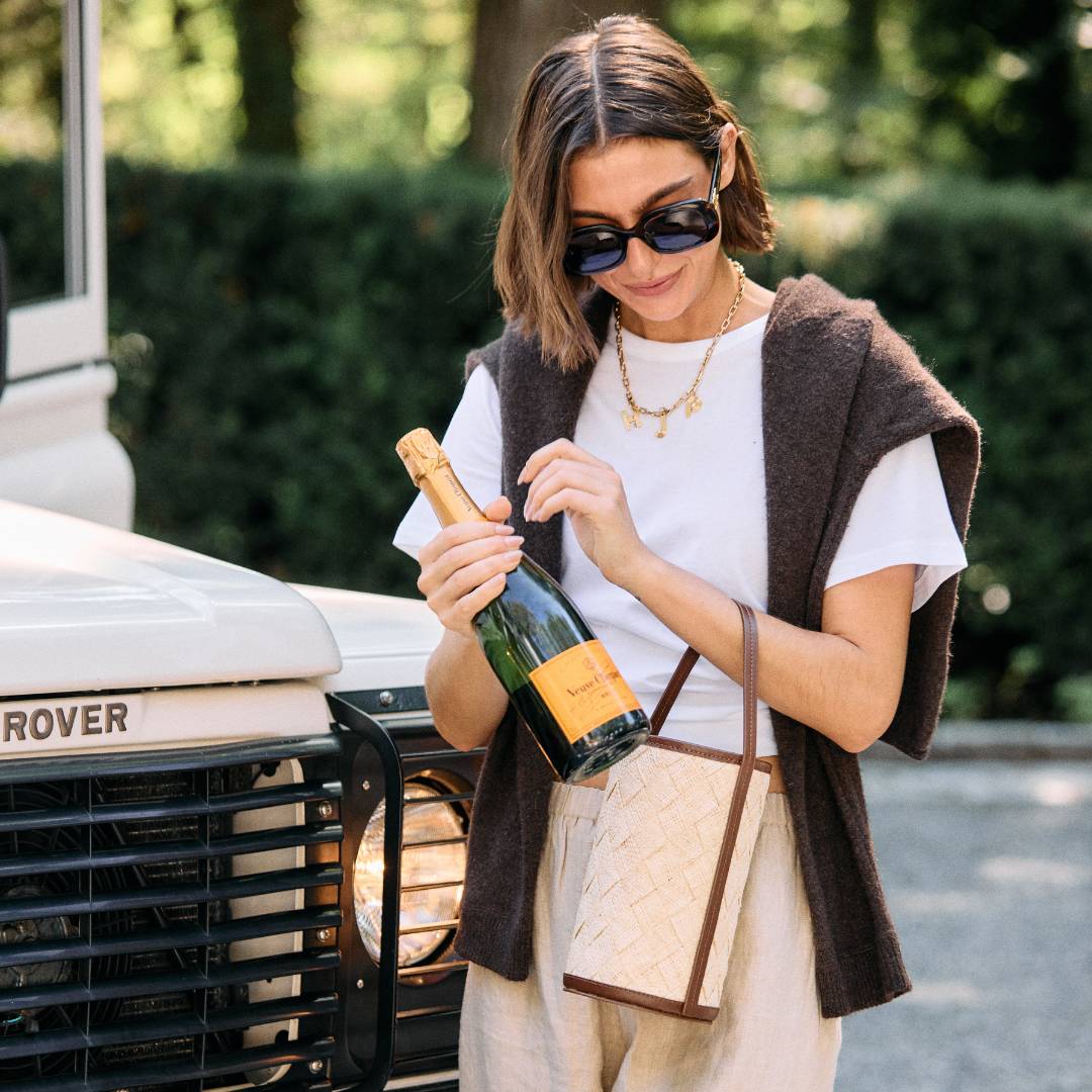 Woven straw cylinder bucket bag with leather trim – The Cylinder