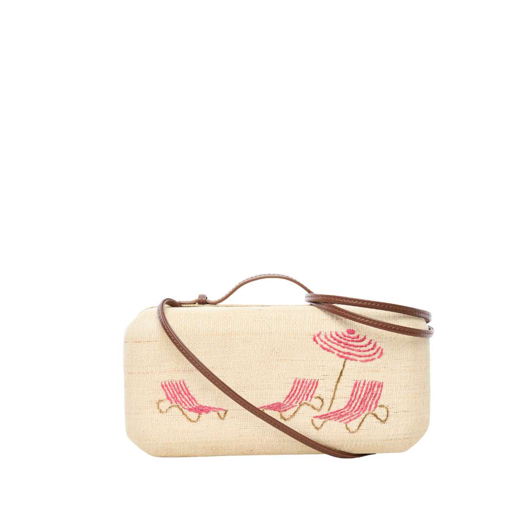 The Deck Chairs Clutch worn with removable leather shoulder strap
