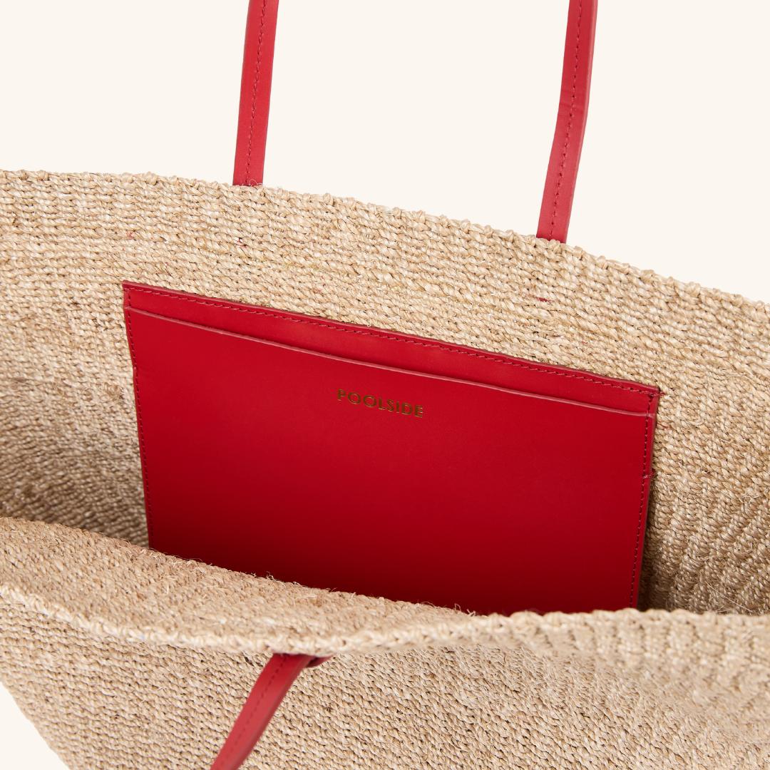 Interior of woven straw east west tote with leather straps – The East West Charm Tote
