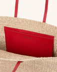 Interior of woven straw east west tote with leather straps – The East West Charm Tote