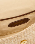 Interior view of The Harper Clutch woven straw clutch