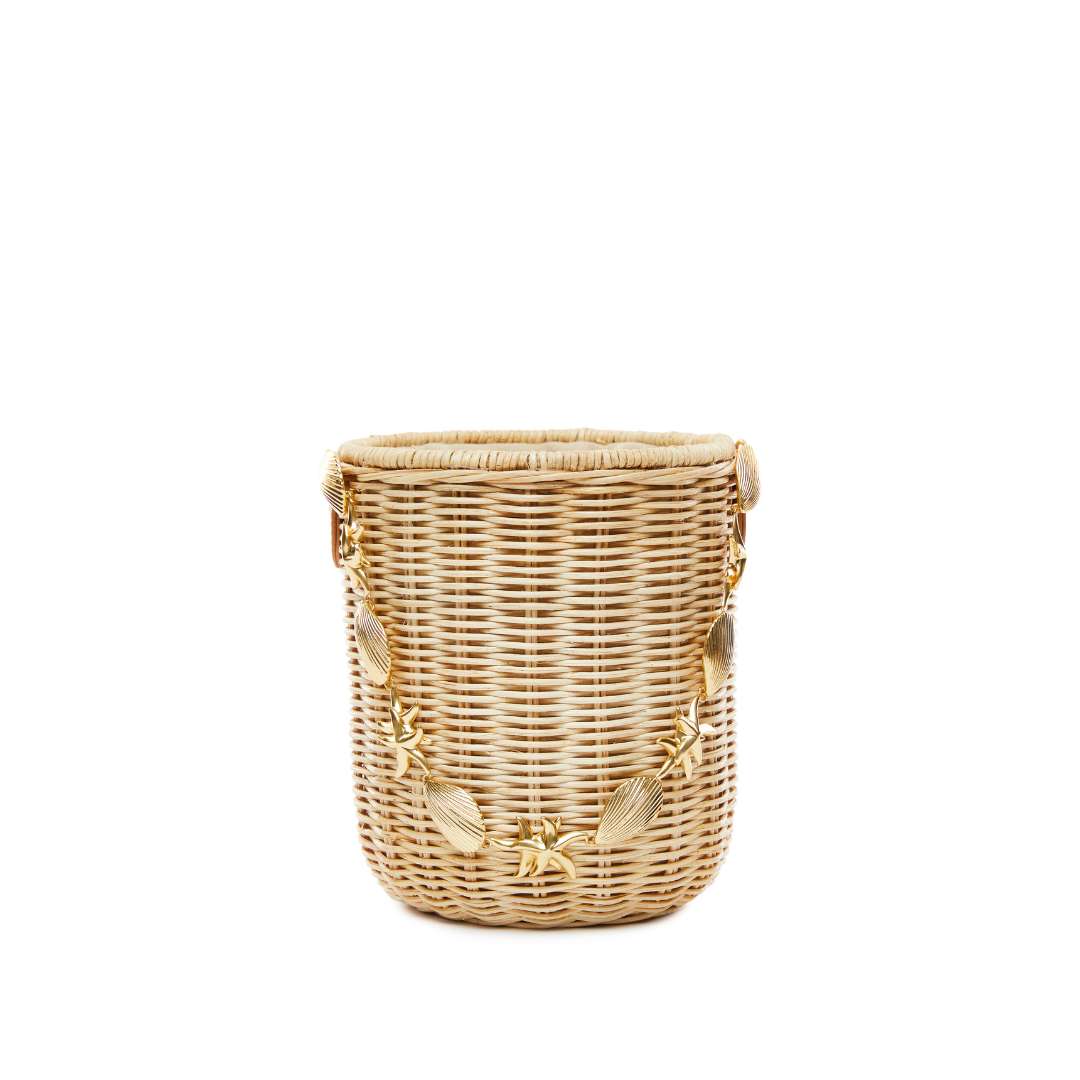 Custom gold tone strap detail on straw bucket bag