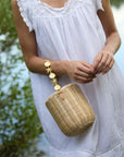 The Island Bucket Bag worn with summer outfit