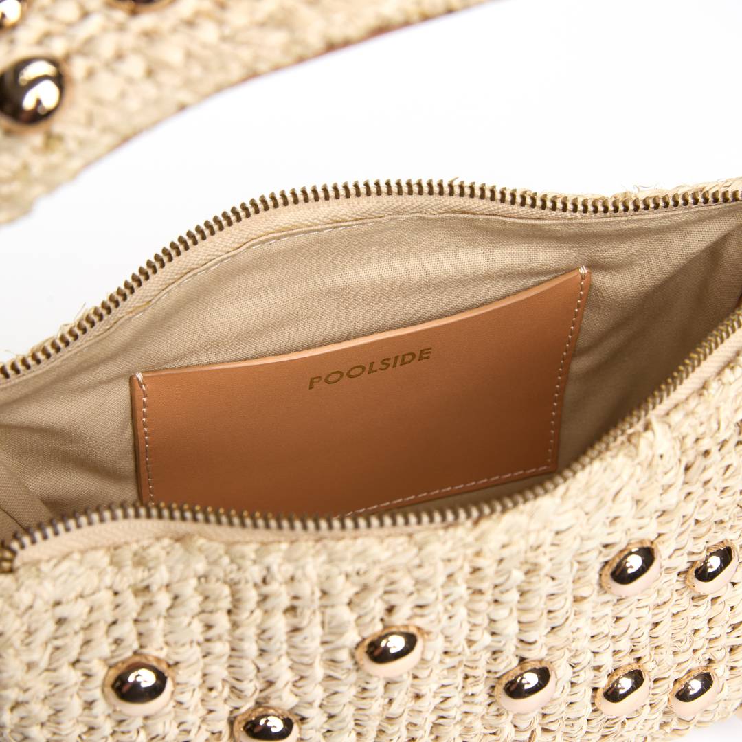 Interior of The Lachlan raffia bag with gold stud accents
