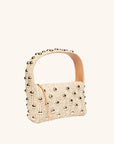 Quarter view of The Lachlan raffia bag with gold stud accents