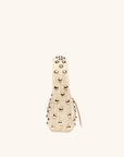 Side view of The Lachlan raffia bag with gold stud accents