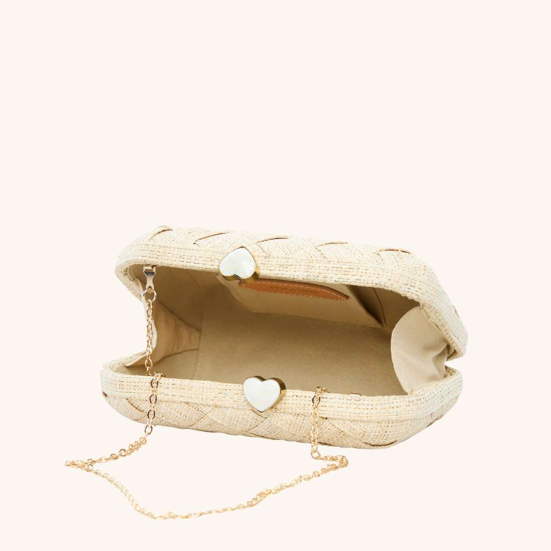 Interior of straw clutch woven with lurex and heart shell clasp – The Love Heart Clutch