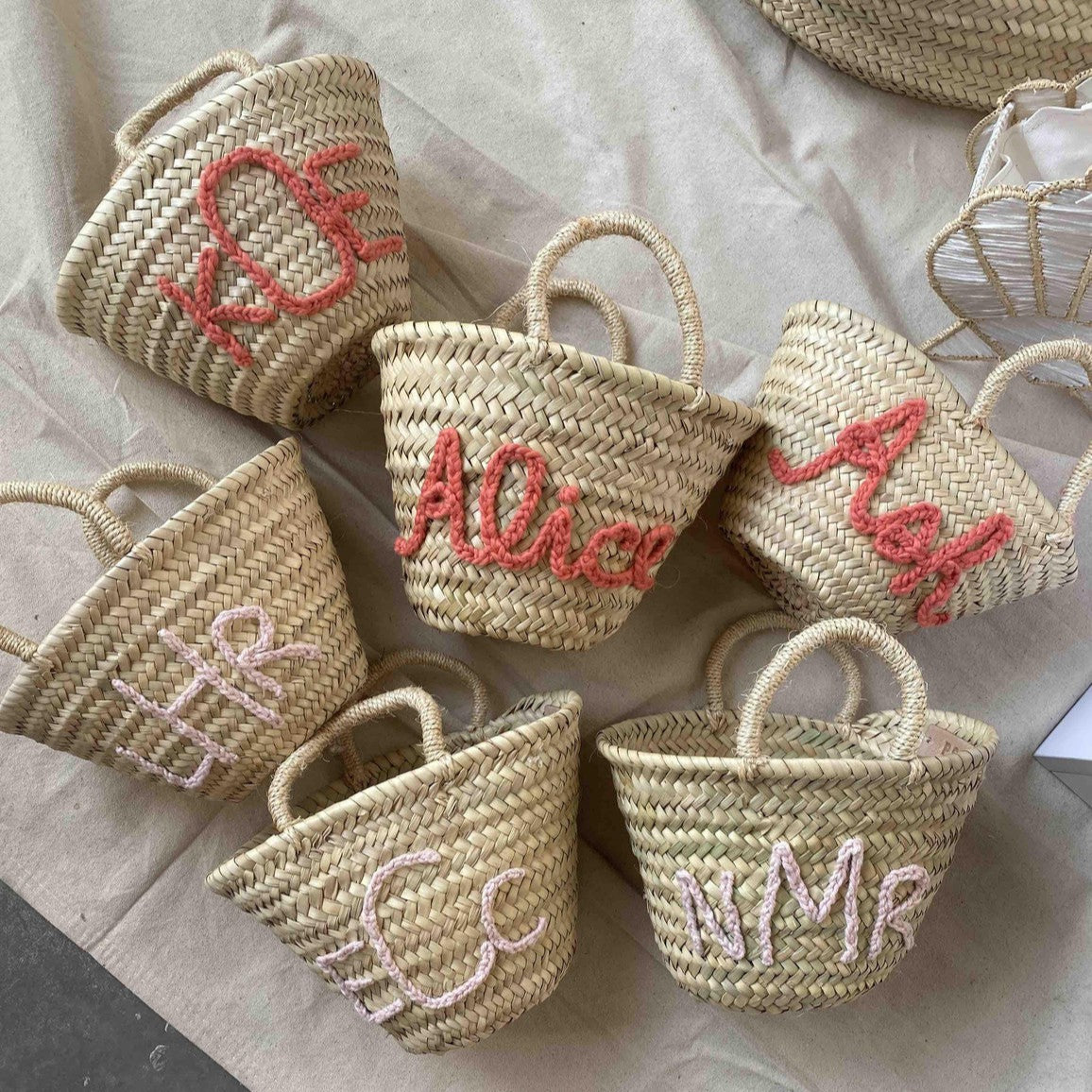 Personalized straw monogram baskets styled for gifting