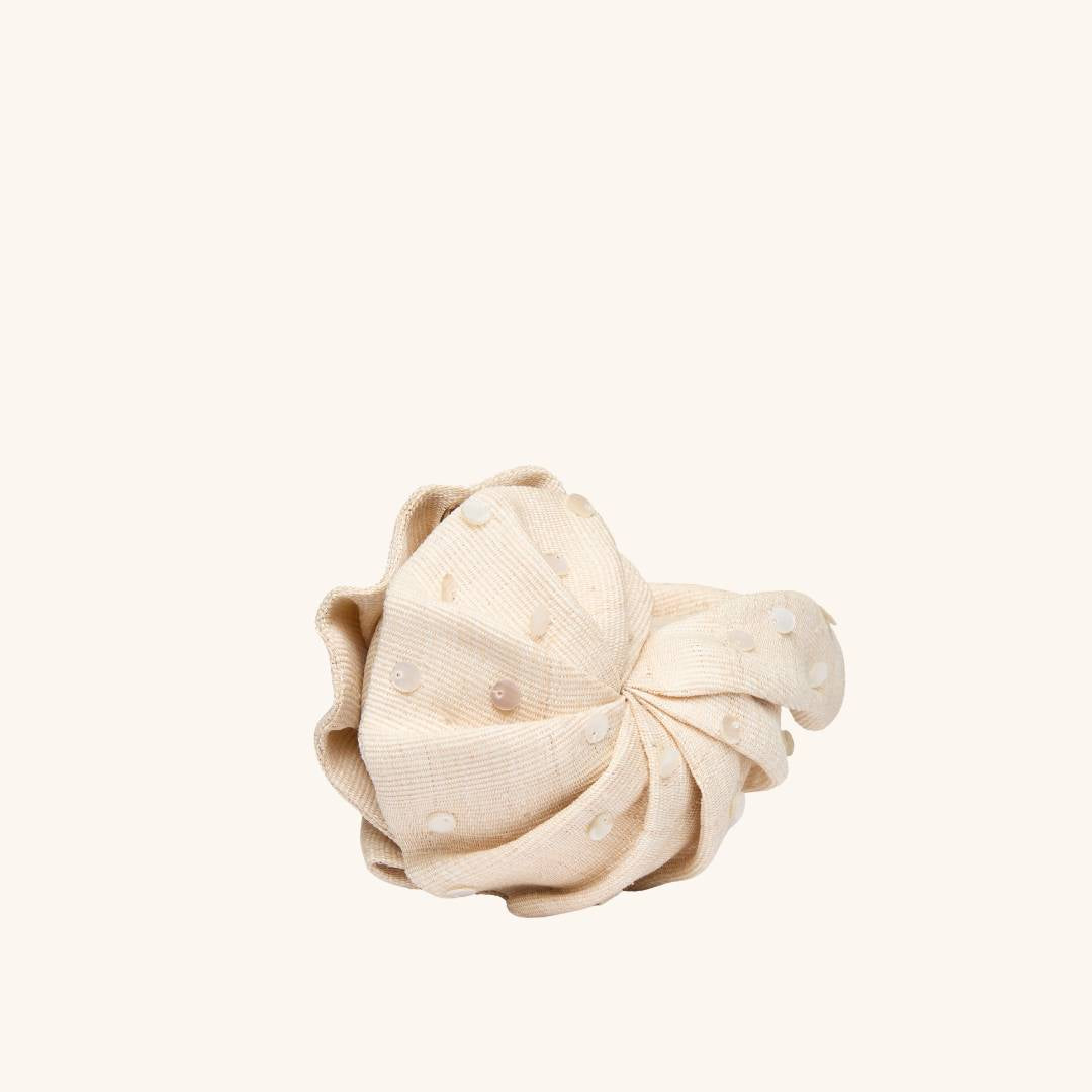 Side view of straw mini clutch - The Origami Nautilus Mini Disco