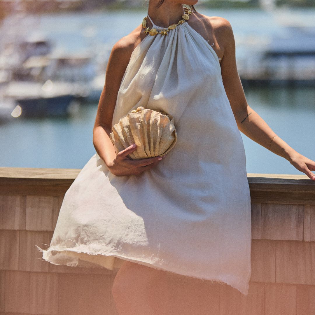 The Origami Scallop worn as a clutch summer occasions