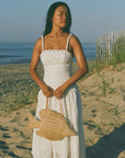 The Paros Tote worn with a white dress
