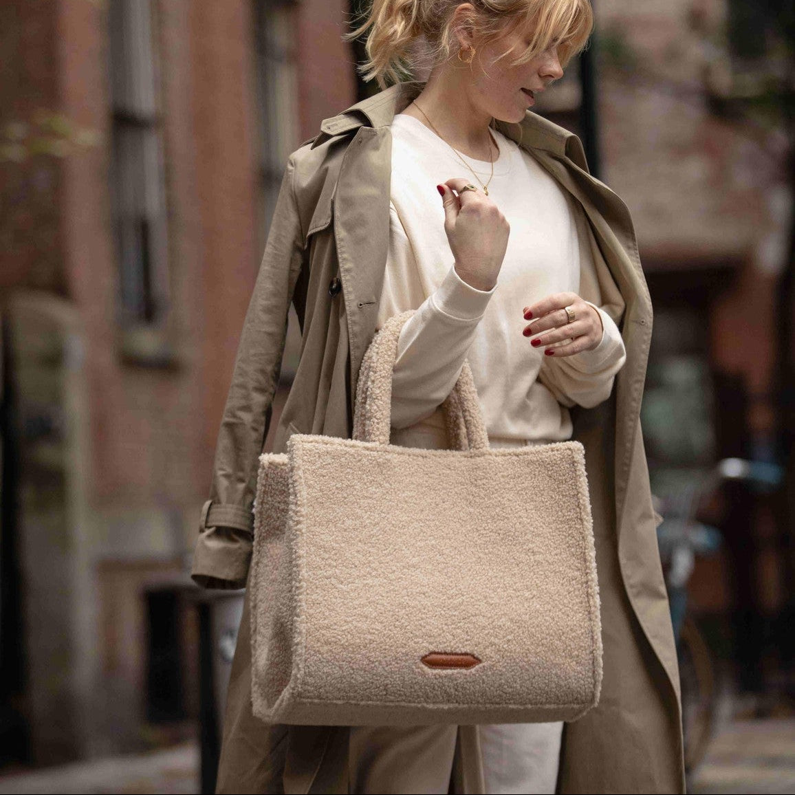 The Teddy Tote sherpa tote bag worn on the arm