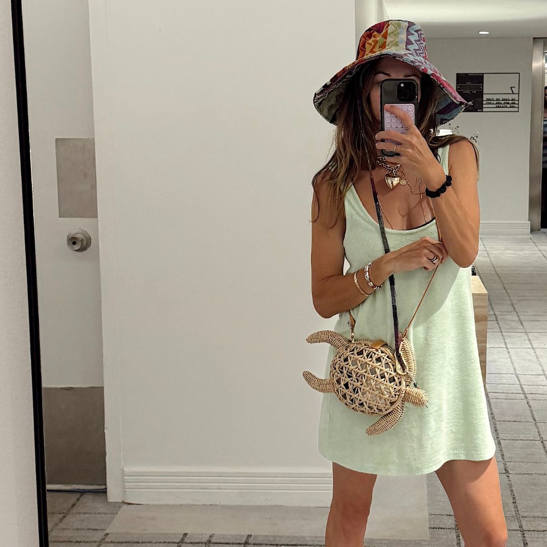 Rattan tortoise clutch worn crossbody